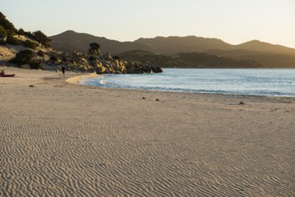 Lonely beach and rocks, sunrise, Spiaggia di Porto Giunco, Villasimius, south coast, Sardinia,