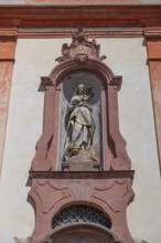 Sculpture of the Virgin Mary above the entrance portal of the baroque St Martin's Church, Riegel am