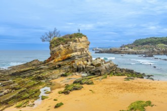 Monument to Neptune Child (Ramon Muriedas) on Camello beach in Santander, Cantabria, Spain
