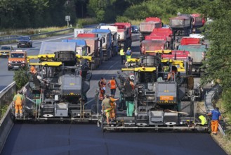 Essen, North Rhine-Westphalia, Germany, Road construction, Asphalt pavers and road rollers lay new,