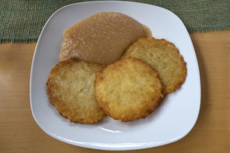 Franconian baggers, potato pancakes with apple sauce served in a pub, Franconia, Bavaria, Germany