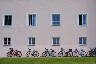 House facade, windows, bicycles, Ossiach Abbey, Ossiach, Lake Ossiach, Carinthia, Austria