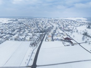 Winter landscape with snow-covered town and surrounding fields, Deckenpfronn, Böblingen district,