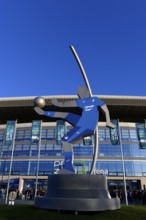 Exterior shot, statue, rotating football player with SAP advert on shirt, glass front, logo, main