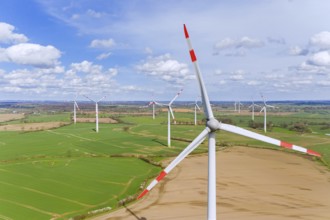 Aerial view over wind turbines at wind park, windfarm in Schleswig-Holstein, Germany