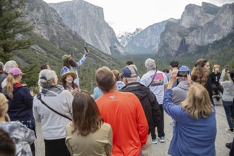 Yosemite National Park, California - A park ranger talks to tourists at the western entrance to