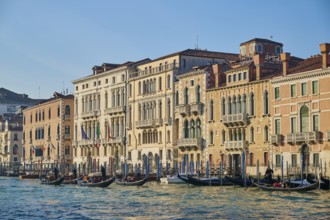 View from 'Canal Grande' on the houses and boats lying in the water in Venice on a sunny day in