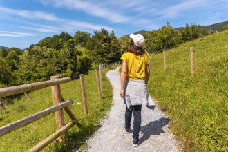 A woman walking on the path in the Jaizubia marsh in the town of Hondarribia or Fuenterrabia in