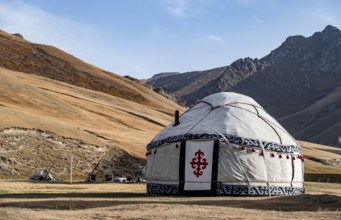 Yurts with yellow hills, Atbashy district in the Naryn region, Kyrgyzstan