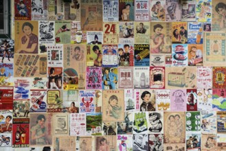 House wall with old posters and advertising, Chinatown, Bangkok, Thailand