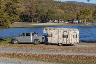 Travel trailer camper at a camp site at Marion County Park on the shore of the Nickajack Lake in