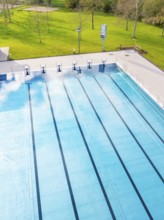 Long swimming lanes in the outdoor pool surrounded by greenery, Calw Stammheim outdoor pool, Calw,