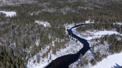Wolf river. unfrozen part of the river in winter. Mastigouche wildlife reserve.. Province of Quebec