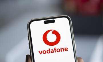 Vodafone logo is displayed on smartphone.