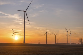 Sunset landscape with several wind turbines in the foreground, near Ulm, Swabian Alb,