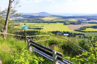 Viewpoint Schneiderfelsen with bench and view of the Pöhlberg, Erzgebirge, Saxony, Germany