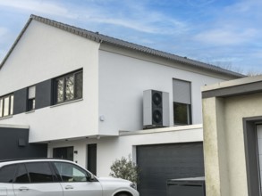Heat pumps on the garage roof of a detached house in Hilden, Germany