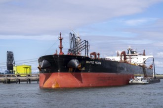 Large tanker White Moon being unloaded, for crude oil, in the petroleum harbour, seaport of