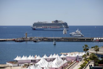 Cannes, France - 23 May 2024: A cruise ship anchors in front of the beach on the Promenade de la