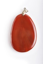 Red onyx pendant isolated on white background, close up