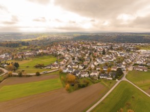 Far-reaching view over a village and fields in an autumnal atmosphere, Tiefenbronn, Germany