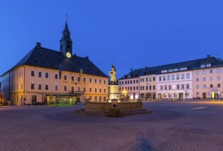 Twilight shot of the town hall on the market square with Barbara Uthmann fountain,