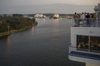 Travellers follow the Finnish ferry entering the port of Travemünde, Bay of Lübeck, Lübeck,