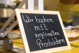 Sign with the inscription We bake with regional products, products from the region, organic
