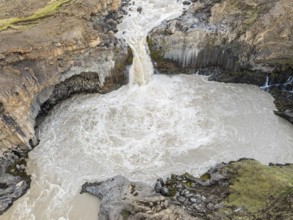 Aerial view of waterfall Aldeyarfoss, canyon of volcanic basalt columns, Þingeyjarsveit, Norðurland