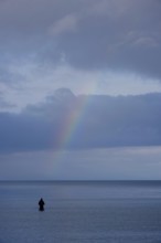 Angler and rainbow, Baltic Sea, Mecklenburg-Western Pomerania, Germany