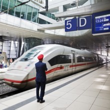 ICE at the centre platform with Deutsche Bahn staff, long-distance train station, airport,