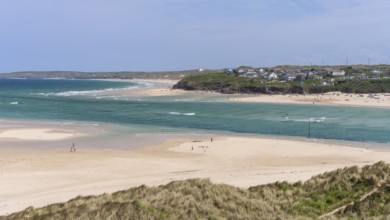 View from Hayle Sands to Hayle Beach and Riviere Towans Beach and some houses. sandy beach beach,