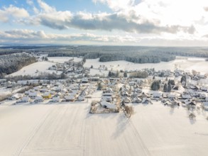 Snowy landscape with a village surrounded by fields and forests, Oberreichenbach, Black Forest,
