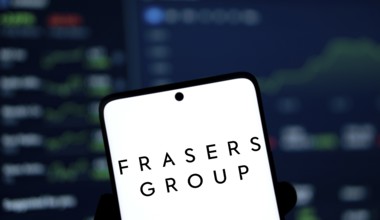 Frasers group logo is displayed on smartphone. Frasers Group plc is a British retail, sport and