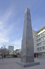 Obelisk and artwork The Strangers and Refugees Monument by Olu Oguibe 2017, documenta 14, building