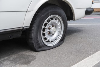 A flat tyre on a car, Wuppertal, Germany