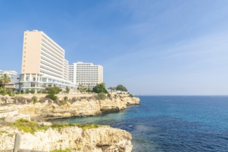 Breathtaking hotels perched on a cliff overlooking the turquoise mediterranean waters in cales de