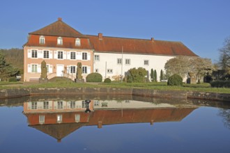 Historic noble house of the Roman Museum with Roman equestrian statues and reflection in the water,