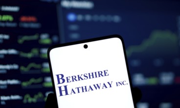 Berkshire Hathaway inc logo is displayed on smartphone. Berkshire Hathaway Inc is an American