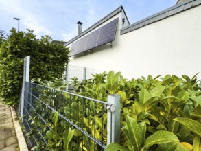 Solar panels on a house wall in Hilden, Germany