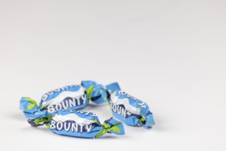 Three Bounty, small chocolate bars on a white background