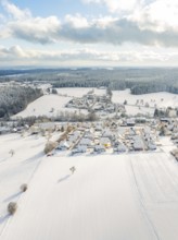 Vast, snow-covered fields and a village under a cloudy sky, Oberreichenbach, Black Forest, district