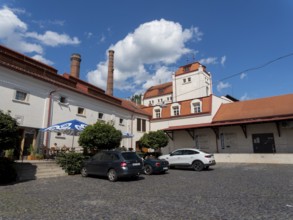 Old brewery buildings, car park in front of brewery, Cvikov, Ceská Lípa, Czech Republic