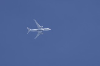 Boeing 787-8 Dreamliner jet aircraft of Qatar airlines flying in a blue sky, England, United