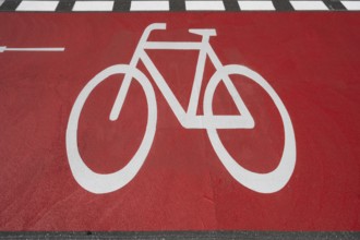 Striking red cycle path, Franconia, Bavaria, Germany