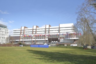 Palace of Europe with seat of the Council of Europe and inscription Council of Europe, EU flag, row