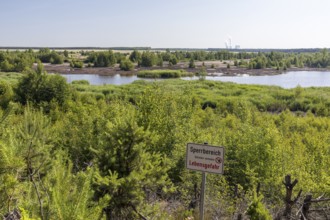 Viewpoint at the still flooded Bergener See with Sperrschidl, in the background the towers of the