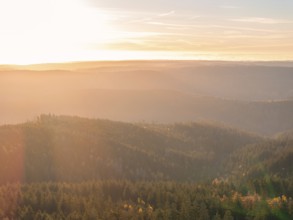 Light play of the sunrise over the wooded hills, quiet expanse, Black Forest, Germany