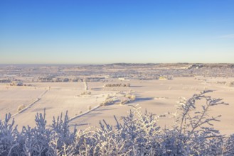 Beautiful countryside winter landscape view a cold sunny day with hoarfrost on the treetops and a
