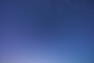 A clear starry sky with soft blue tones at dusk creates a peaceful atmosphere, Spessart, Bavaria